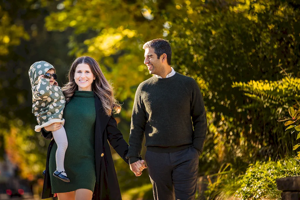 Family walking together on the sidewalks of East York for their family photography session