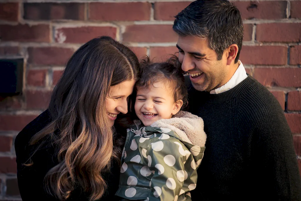A family photo at home against the iconic East York red brick