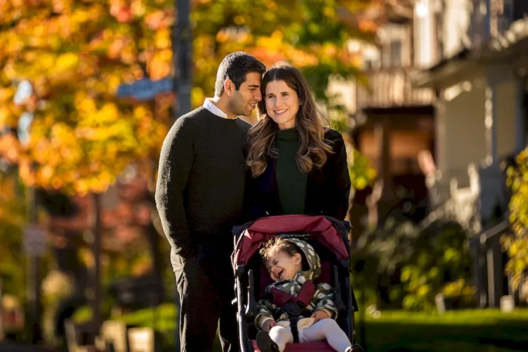 Lifestyle family portrait walking together in fall