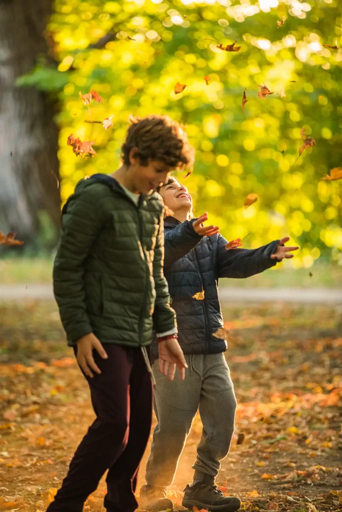 Candid fall photo of two brothers during a family session in East York