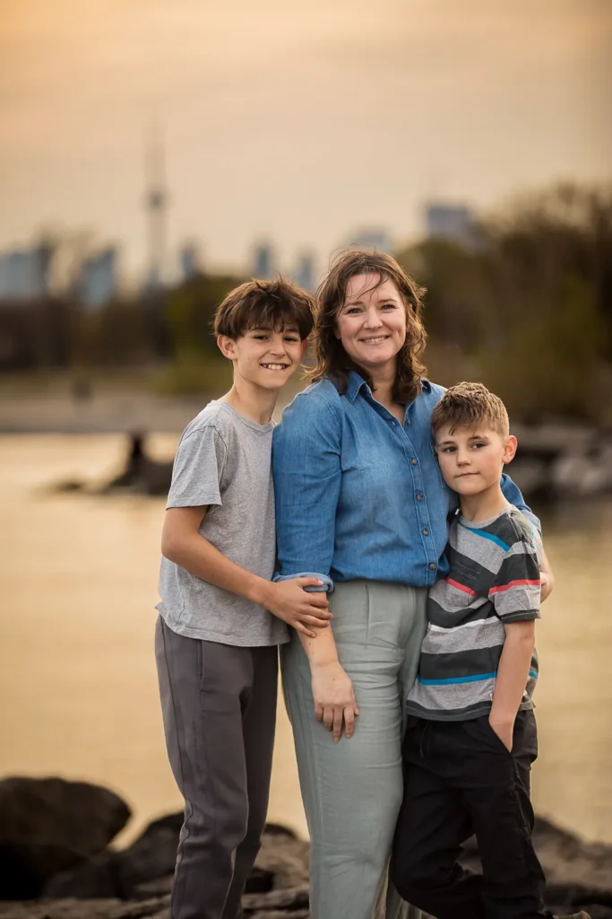 family photo with Toronto skyline in background from The Beaches