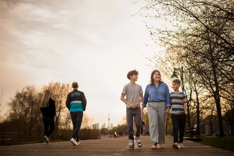 family photos walking on the board walk at sunset. The Beaches Toronto